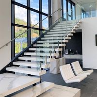 Escalier droit moderne Tanlong à double volée avec éclairage LED encastré, garde-corps en verre et acier inoxydable poli, marches en marbre