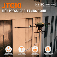 Drone de nettoyage haute pression UAV à jet d'eau de précision pour murs-rideaux en verre, couverture de surface efficace pour les travaux de maintenance de tours de bureaux