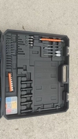 Ensemble d'outils électriques au lithium sans balais quatre pièces du fabricant : perceuse à percussion au lithium, meuleuse d'angle, perceuse électrique, jeu de clés