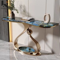 Console d'entrée minimaliste avec plateau en pierre frittée et structure en acier inoxydable