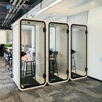 Cabine acoustique confortable pour réunions et formations, avec petit cadre métallique et fonction musicale