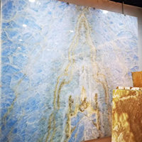 Tops Offre Spéciale pierre naturelle polie carreaux d'onyx bleu rétro-éclairé dalle de marbre d'onyx bleu glace pour panneau mural en onyx