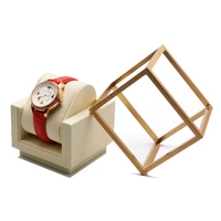 Support de présentation de montres haut de gamme, surélevé, avec coussin en velours, pour vitrine de magasin de montres.