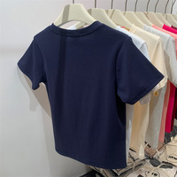 T-shirt basique en coton tricoté pour femme, nouveau pull d'été amincissant décontracté, haut à épaule droite, couleur unie simple, teint uni