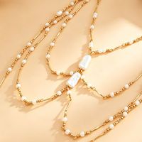 Collier long superposé en perles fines, luxe léger, élégance délicate, accessoire polyvalent