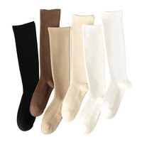 Vente en gros bas personnalisés quatre saisons confort mollet chaussettes hautes massage des cuisses chaussettes de compression de haute qualité