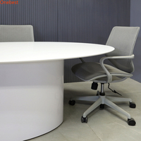 Table élévatrice pour moniteur d'ordinateur de petite taille de forme ovale Table de conférence à surface solide Corian de conception moderne pour six personnes