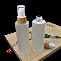 30 50 100 120 150 Ml Bening Buram Silinder Bahu Datar Pompa Losion Kaca Botol Minyak dengan Topi Bambu Botol Semprot Parfum