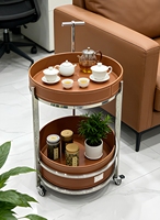 Chariot à thé moderne fait main en acier inoxydable et cuir, durable et écologique, avec roues et design de selle amovible, pour salon et mobilier de maison