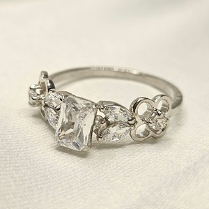 Anillo de compromiso y eternidad con halo de diamantes talla VVS, chapado en plata, joyería de alta calidad al por mayor, estilo moderno para fiestas. - Product Image 1