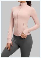 Veste de yoga zippée intégrale pour femme, manches longues, col montant, poches latérales zippées, passe-pouces, coupe ajustée, coutures discrètes, haut de sport pour la course et l'entraînement en salle de sport