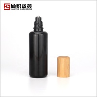 Rouleau sur la bouteille 100 ml 50 ml noir bouteille en verre 30 ml 15 ml bouteille cosmétique rouleau sur avec plafond en bambou pour huile de massage huile essentielle