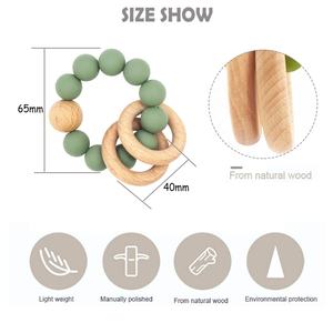 Nouveau produit bracelet <span class=keywords><strong>de</strong></span> <span class=keywords><strong>dentition</strong></span> en bois naturel pour bébé avec <span class=keywords><strong>anneau</strong></span> en silicone développement des compétences sensorielles pour les bébés <span class=keywords><strong>de</strong></span> <span class=keywords><strong>dentition</strong></span> - Product Image 2