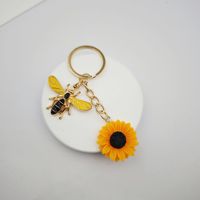 Porte-clés décapsuleur en alliage de zinc motif tournesol et abeille, inspirant, pour sacs féminins, cadeau pour petites entreprises, vente en gros, produit phare