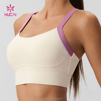 Soutien-gorge de sport pour femme, personnalisé avec logo OEM, en nylon et élasthanne, à maintien élevé, avec décolleté en U, dos croisé et bretelles contrastantes ajustables sous la poitrine