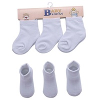 Prix de gros d'usine Chaussettes blanches pour nouveau-nés Chaussettes unies en coton blanc pour bébés Chaussettes de printemps