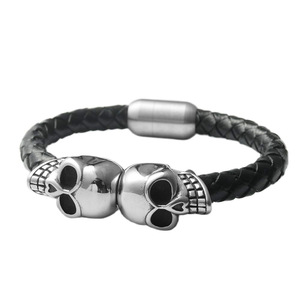 Titanium Steel Skull <b>Bracelet</b> Black Woven <b>Leather</b> Band Fashion Jewelry for Men and Women - Product Image 1
