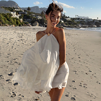 Robe mini dos nu en mousseline tissée blanche écologique pour femme, style licou, fluide et ample, sans manches, idéale pour les vacances d'été à la plage ou comme tenue de villégiature