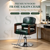 Fauteuil de barbier vintage en cuir vert avec accoudoirs en bois massif, chaise de coiffure robuste à vérin hydraulique pour salon de coiffure
