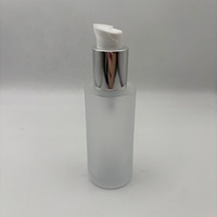 Haute qualité 60ml huile essentielle bouteille en verre forme ronde et 18/410 argent cosmétique Lotion traitement crème pompe