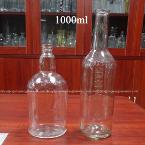 Botella de vidrio redonda de 1 litro con base con hoyuelos para <span class=keywords><strong>whisky</strong></span>, venta al por mayor de fábrica - Product Image 3