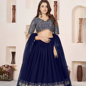 Lehenga bleu foncé moderne et fluide en georgette douce, orné d'une bordure en dentelle à sequins argentés, ajoute une touche d'élégance royale et de brillance. Prix de gros. - Product Image 1