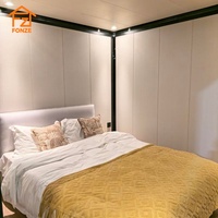 Maison conteneur extensible de luxe moderne en verre de 10 pieds avec rideaux intelligents et cuisine interactive ouverte pour salon et chambre