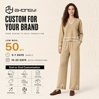Ensemble deux pièces élégant en maille pour femme, idéal pour l'automne, le quotidien, le bureau ou la rue : pull col en V et pantalon large avec bordure contrastante