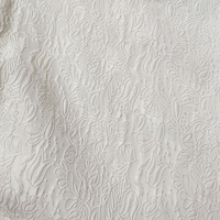 Tissu jacquard brodé floral miniature blanc et noir, matière spéciale Nais, 100 % polyester, léger, 150 g/m², pour mariage.