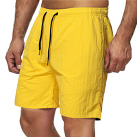 Shorts de sport respirants à séchage rapide pour hommes, personnalisables OEM, couleur unie, grande taille, avec cordon de serrage, pour la gym, la course, l'entraînement et la plage