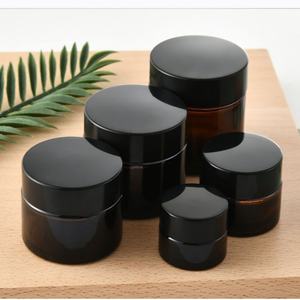 Vente en gros de pots cosmétiques vides en verre avec couvercles noirs pour l'emballage de gommage au beurre corporel Tailles de 5g à 100g pour les soins de la peau et la crème pour les yeux - Product Image 1