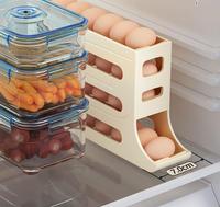 Accessoire de cuisine Boîte de rangement automatique d'œufs Porte-conteneur roulant pour réfrigérateur Organisateur d'œufs Distributeur de conteneurs