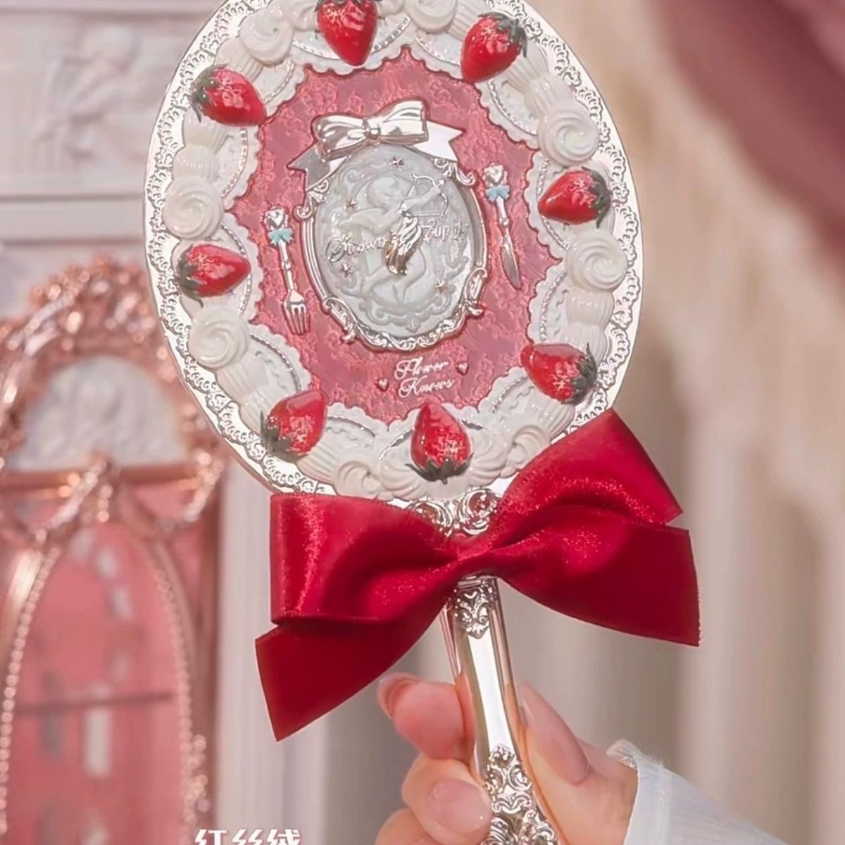 Handheld red velvet mirror