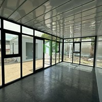 Maison conteneur détachable de 20 pieds avec mur en verre, préfabriquée en kit, de luxe, modulaire, design méditerranéen, pour usage commercial, écologique