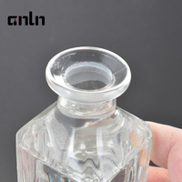 Vente en gros de flacons de parfum en verre transparent de 150 ml et 230 ml, disponibles pour logo et couleur personnalisés