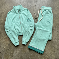Setelan celana olahraga dan hoodie dua potong untuk pria, model vintage, potongan longgar, dengan logo dan saku dada.
