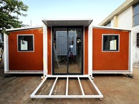 Casa Container Espandibile con Telaio Nero e Layout Interno Personalizzabile, Adatta per Vivere in Singolarità o in Comunità