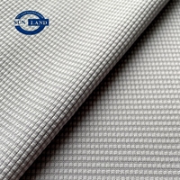 T-shirt de sport tricoté à la machine circulaire demi-brillant 100% polyester mini tissu gaufré