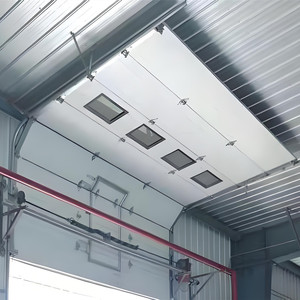 Porte sectionnelle industrielle électrique à isolation thermique, levage vertical avec petite porte de passage pour les opérations en <span class=keywords><strong>baie</strong></span> de chargement - Product Image 5