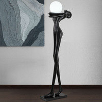 Lampadaire LED en acier en forme de sphère, design humanoïde artistique, abat-jour en verre, angle de faisceau de 270°, design vertical vintage pour l'éclairage des halls d'hôtel