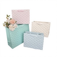 Sacs cadeaux en papier matelassé pastel imprimés offset avec poignées en ruban pour les faveurs de mariage et les projets d'artisanat