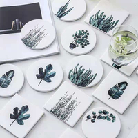 Dessous de verre absorbants en céramique avec motif de feuille noir pour ensemble de tapis et de tampons de table en bois pour boissons