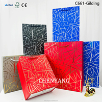 Sacs-cadeaux en papier cartonné blanc de luxe de haute qualité pour la vente au détail en gros et emballage de marque Sacs-cadeaux en papier cartonné blanc de qualité supérieure