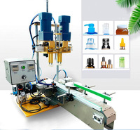 Machine de capsulage de bouteilles de bec de canard entièrement automatique avec bande transporteuse Capsuleuse de capsulage de bouteilles d'huile essentielle Pneumatique