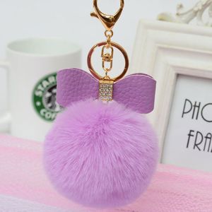 LLavero de piel esponjosa con pompón para mujer y niña, de piel sintética Pompón, lazo de diamantes de imitación, pompón de bola de <span class=keywords><strong>pelo</strong></span> con lazo, venta al por mayor - Product Image 2