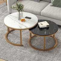 Table basse ronde moderne pour salon, ensemble de 2 tables gigognes avec plateau en marbre noir et blanc pour usage domestique.