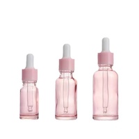 Bouteille d'huile essentielle en verre rose de fantaisie de 20ml en forme de cylindre avec compte-gouttes pour la beauté soins de la peau sérum et crème Commande minimum 500 pièces