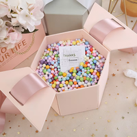 Boîte à rouge à lèvres et parfum rigide en papier recyclable personnalisée directement de l'usine, emballage cadeau créatif avec nœud et fleur, revêtement UV durable