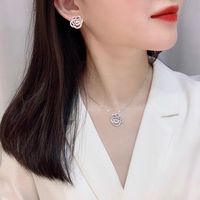 Conjunto de Joyería Unisex de Moda: Collar con Colgante de Moissanita de 1 Quilate con Engaste de Garra en Forma de Bola de Plata S925 y Pendientes