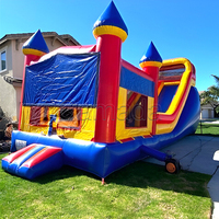 Château Gonflable Commercial Bleu Multicolore avec Toboggan et Zone de Saut pour Fêtes en Extérieur